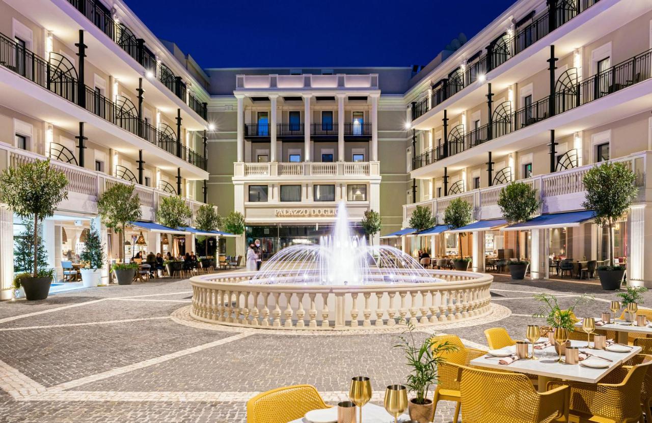 Hotel Palazzo Doglio Cagliari Exterior foto The Hotel's courtyard
